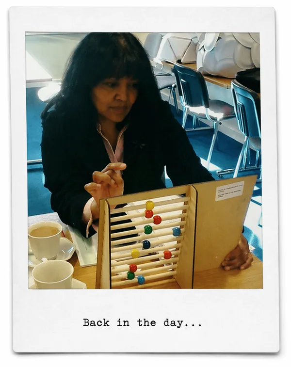 An early adopter holding a physical wooden abacus with coloured beads, captioned 'Back in the day…'