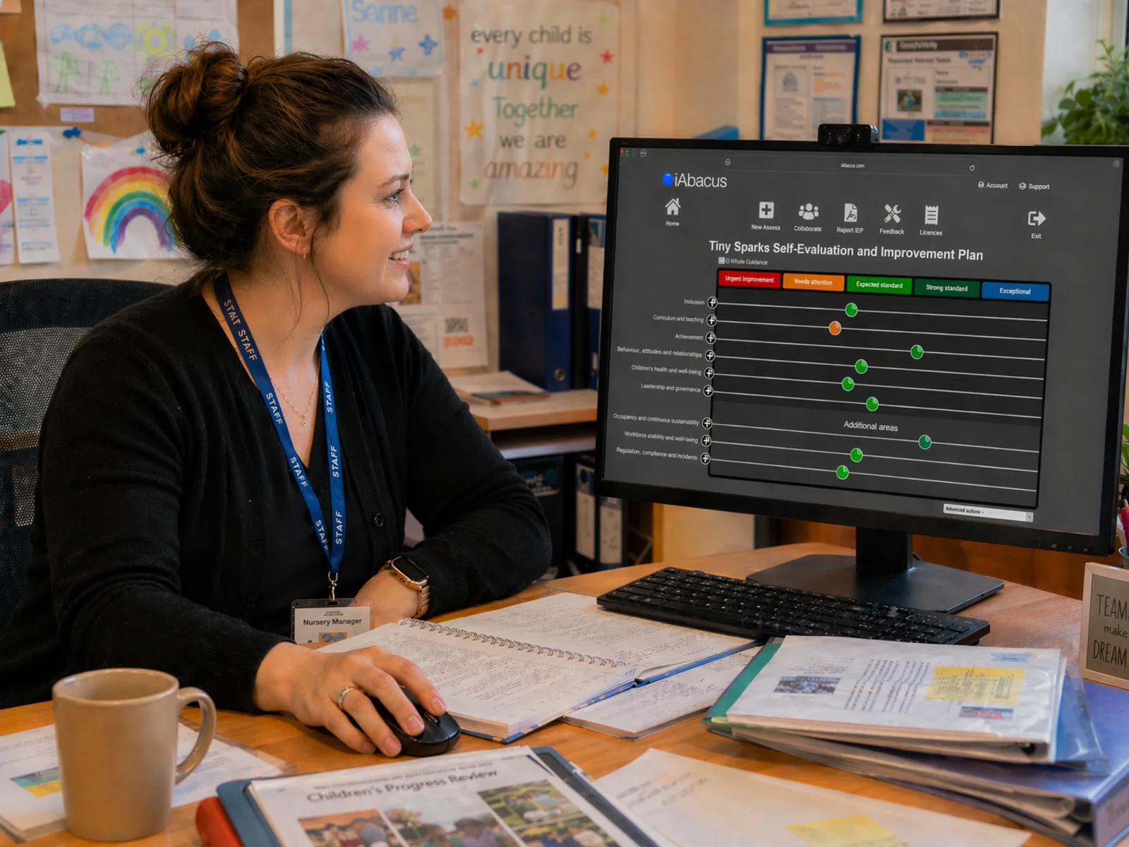 The same nursery leader now working calmly at her desk, using the iAbacus Tiny Sparks Self-Evaluation and Improvement Plan on screen with beads placed across the five-point scale for each evaluation area.